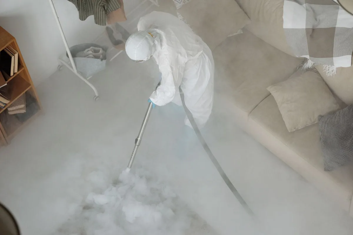 Biohazard cleanup technician in protective equipment, Linton Hall, VA
